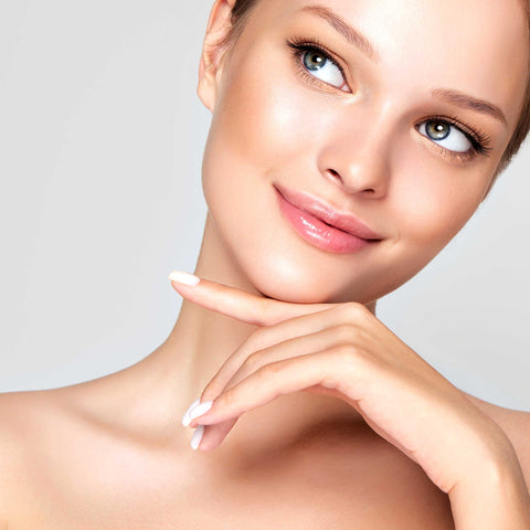 Woman with clear and radiant skin from a chemical peel.