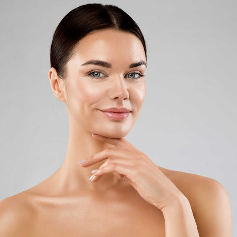 A woman with clear and radiant skin from a chemical peel.